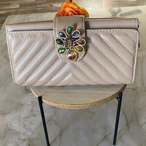 Elegant Camel Quilted Wallet with Jewel details.